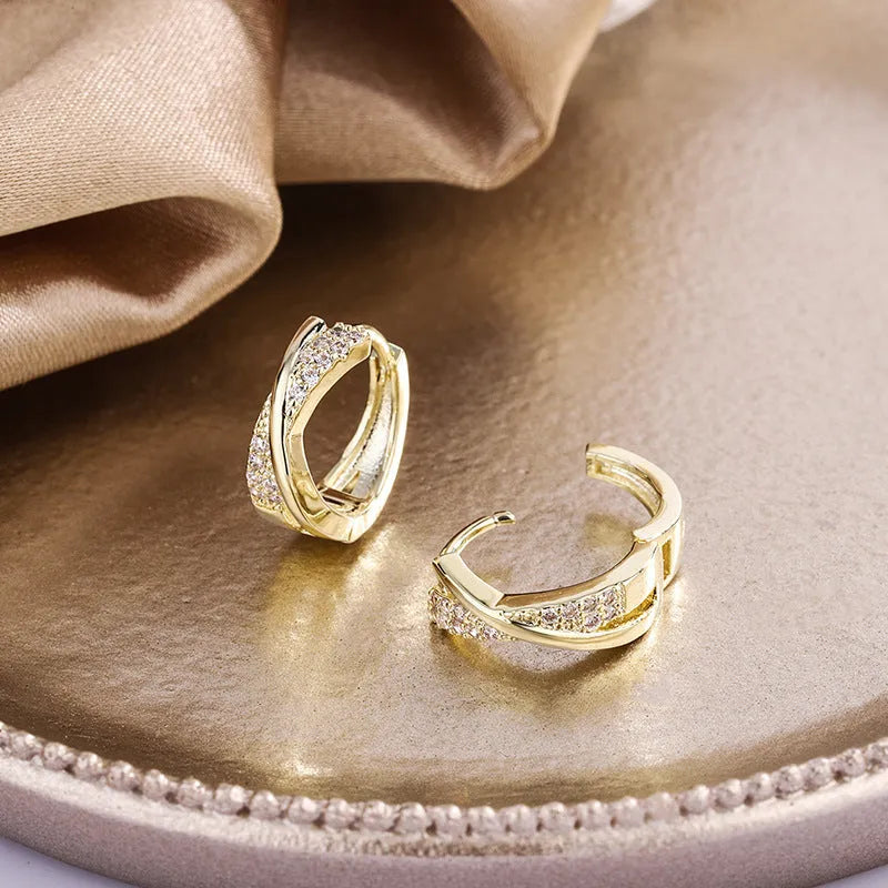 Geometric copper earrings with zircon treatment in 14K yellow colour, showing structured design and clean lines