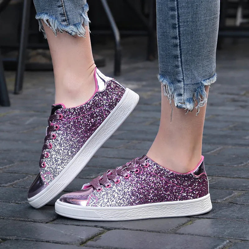 Women's black low-top lace-up shoes with glittering sequins on the upper.