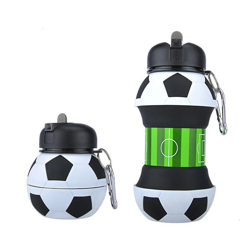 White collapsible soccer ball silicone water bottle with straw and black carrying clip on white background