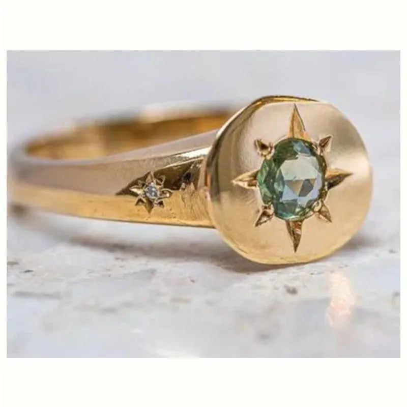 Golden oval asterism zircon ring with star design and adjustable opening