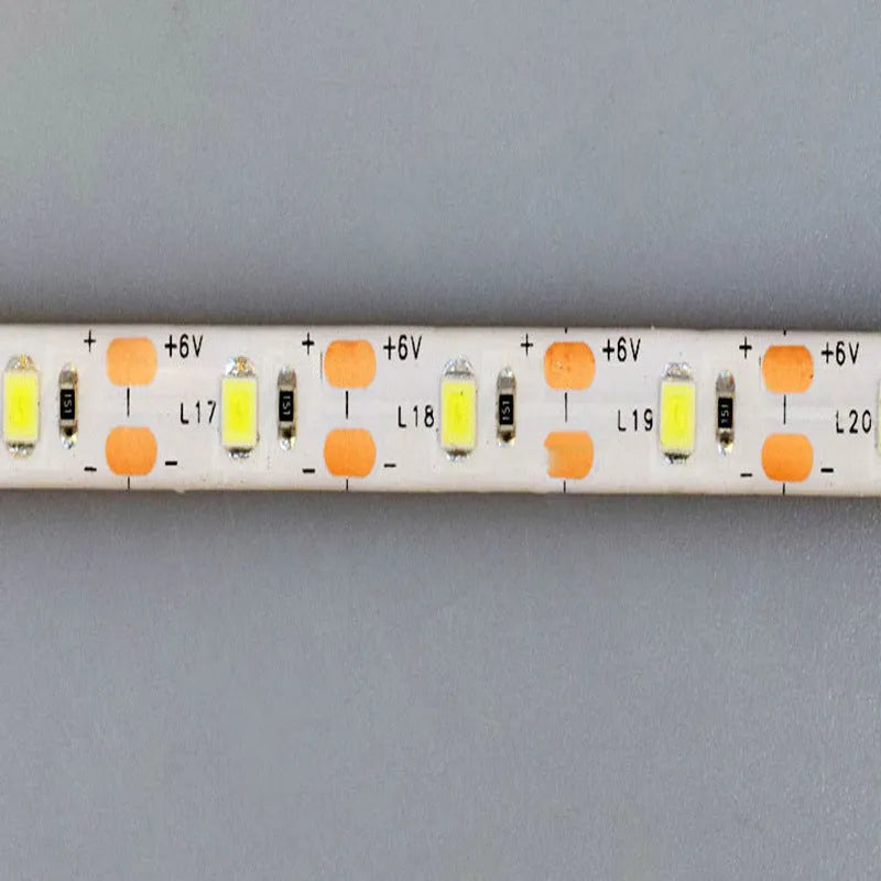 Photon flexible USB LED light strip bent into a curve showing its 60 small white LED beads.
