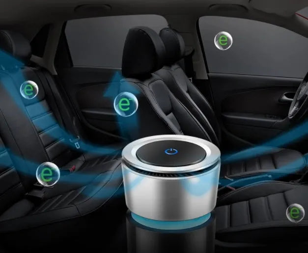 USB negative ion car air purifier in grey, compact 75x75x165mm size on a desk