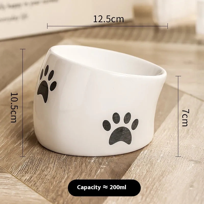 Ceramic cat bowl with high foot design in cat's paw pattern available in multiple colours