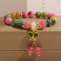 Women's tourmaline bracelet with a natural jade colour butterfly pendant and rhinestone details.
