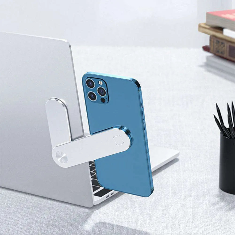 Black aluminium laptop phone holder with magnetic clip mounted to side of monitor