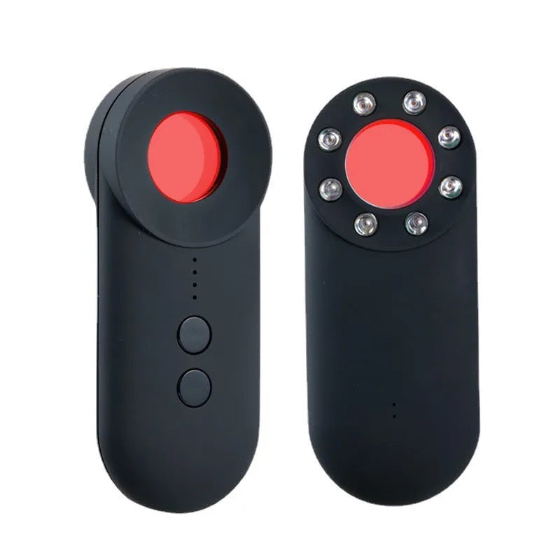 Black portable camera and GPS signal detector with USB charging port on a flat surface.