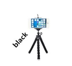 Mini flexible sponge octopus tripod stand holding a smartphone on a desk