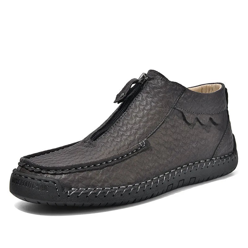 Men's black slip-on loafers with round toe and visible stitching on a rubber sole.