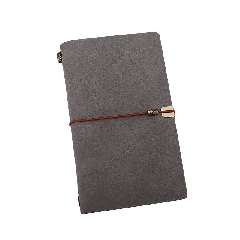 A6 imitation leather notebook with cowhide rope decoration, open to show flat-lying wireless binding.