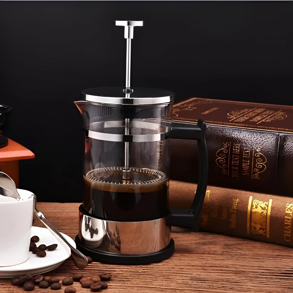 Manual pour-over coffee maker with glass carafe and stainless steel filter, 350ml capacity.
