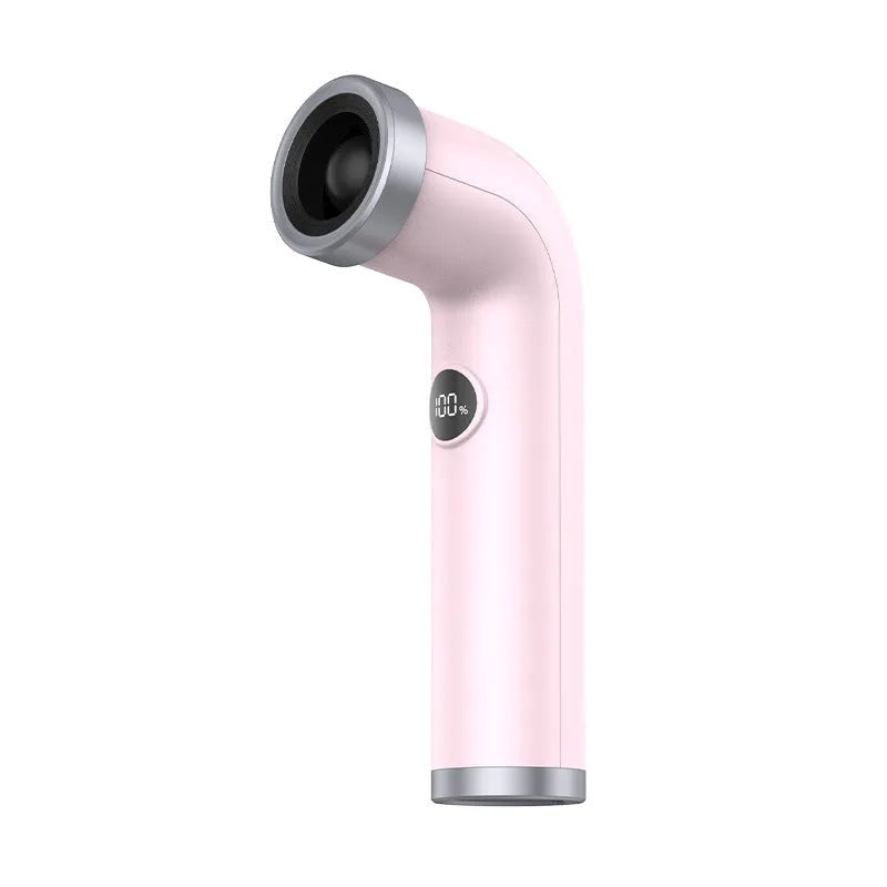 A compact apricot, pink, or yellow bladeless turbine fan on a desk.