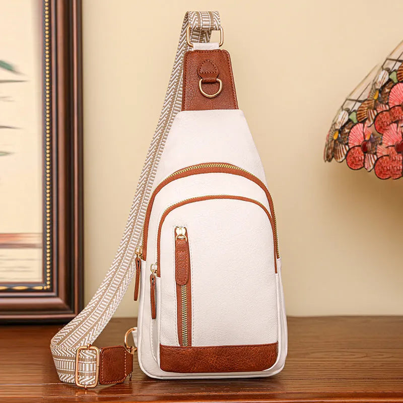 Women's soft PU chest bag in beige colour showing open pocket and crossbody strap