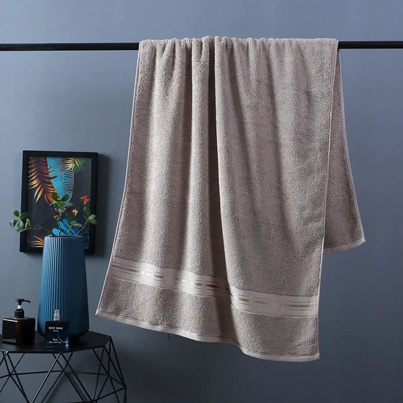 Three-piece cotton bath towel set in floral colours showing bath towel, hand towel and face cloth with optional logo printing