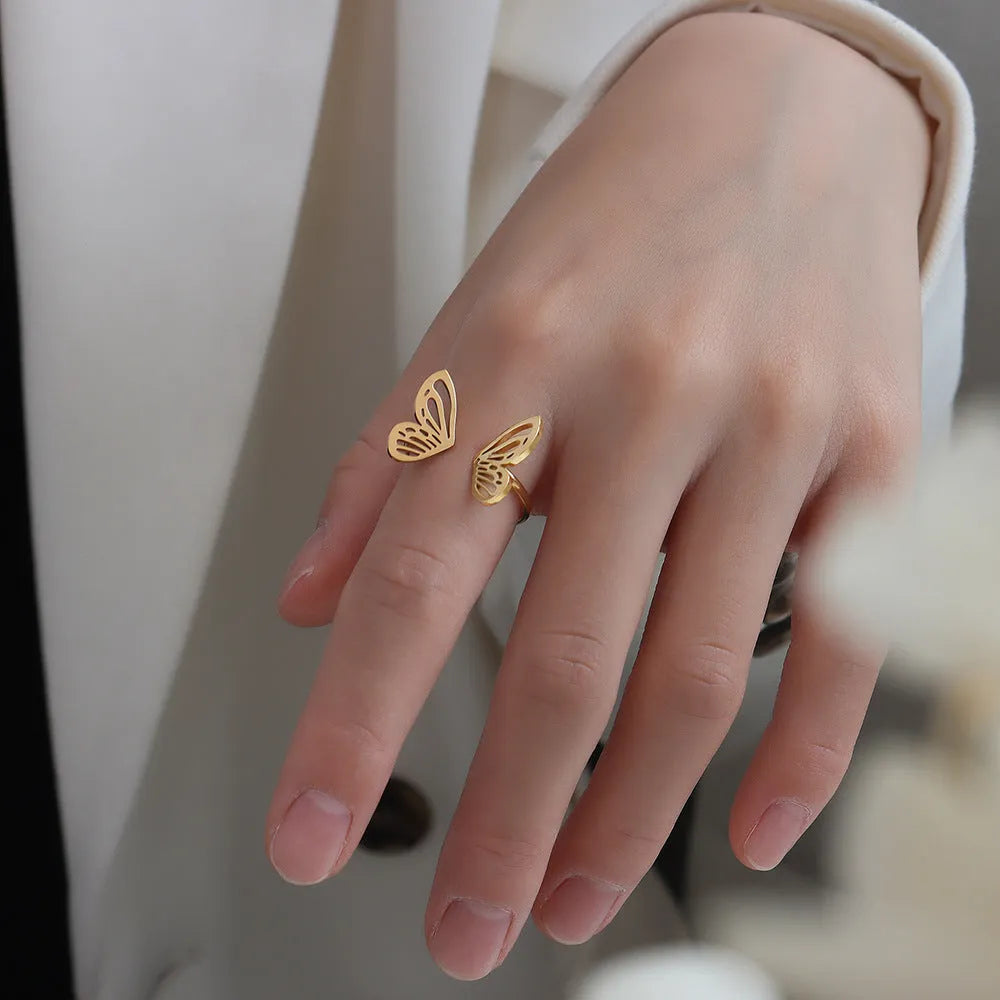 Titanium steel hollow butterfly ring with adjustable opening in gold colour