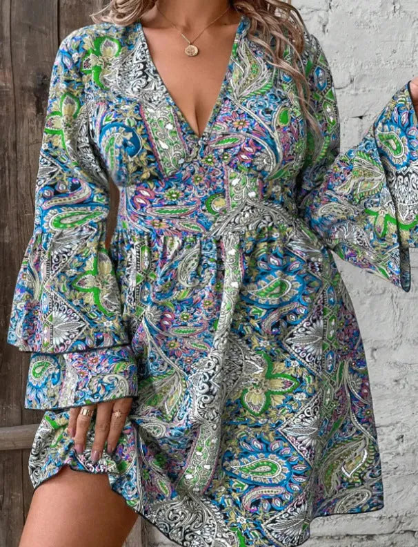Women's plus size Bohemian style dress with V-neck, long bell sleeves, and an A-line short skirt in a solid colour.