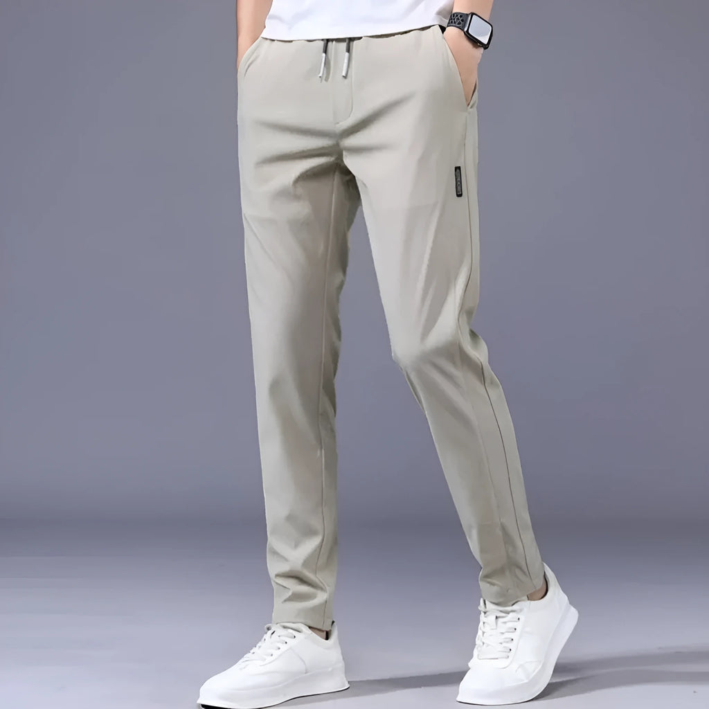 Men's drawstring trousers Korean version loose straight leg sweatpants in khaki colour on model