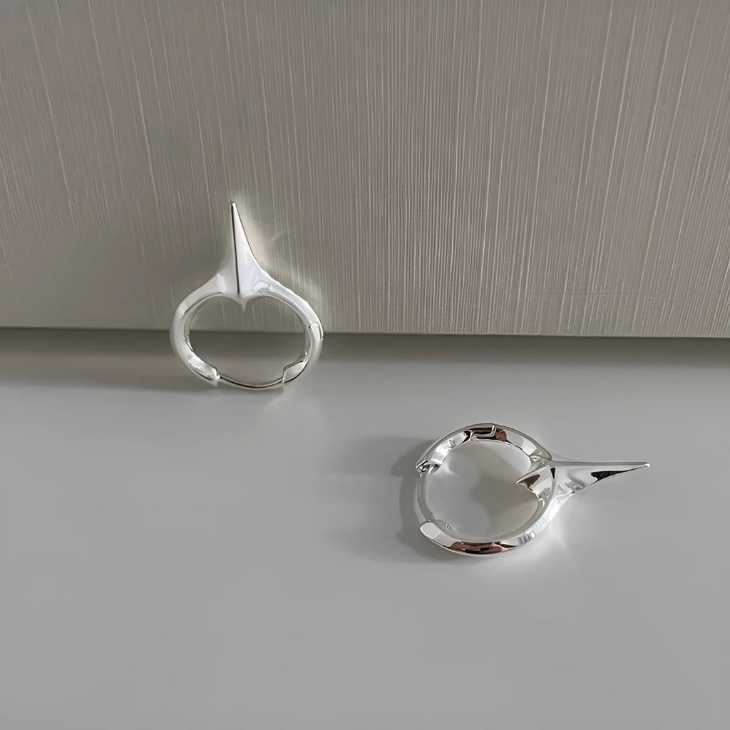 Geometric star stud earrings for women with white gold plated finish on copper.
