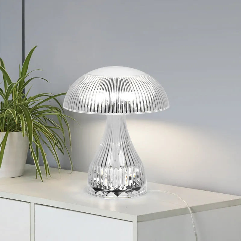 Small white rechargeable table lamp with USB cable and three colour light settings.