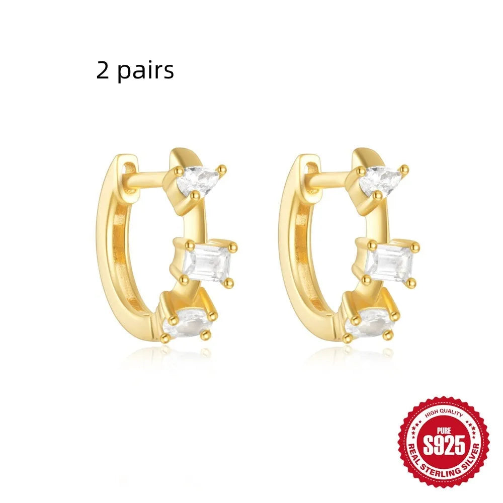 Small round geometric sterling silver stud earrings with diamond accents in gold or silver finish