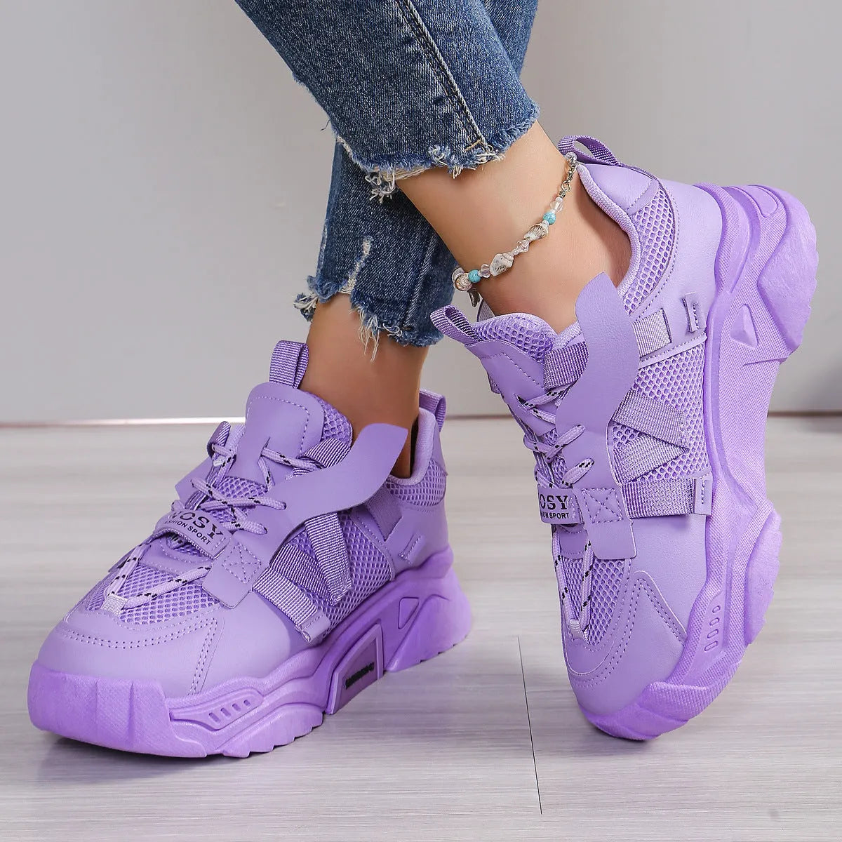 Women's purple platform mesh sports shoe with front lace-up, shown on a white background.