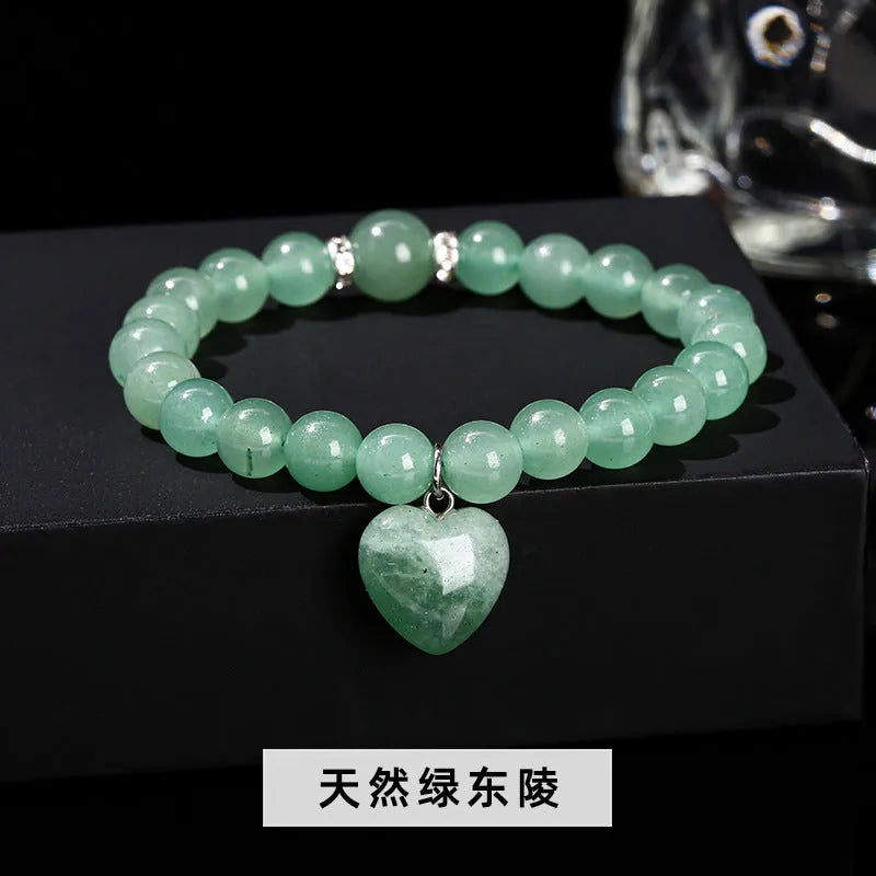 Handmade natural crystal bracelet with six stone types in geometric round beads, showing 8mm and 10mm purity size options