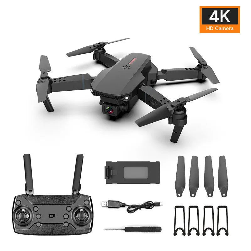 Grey foldable 4K dual camera aerial drone with remote control and spare blades