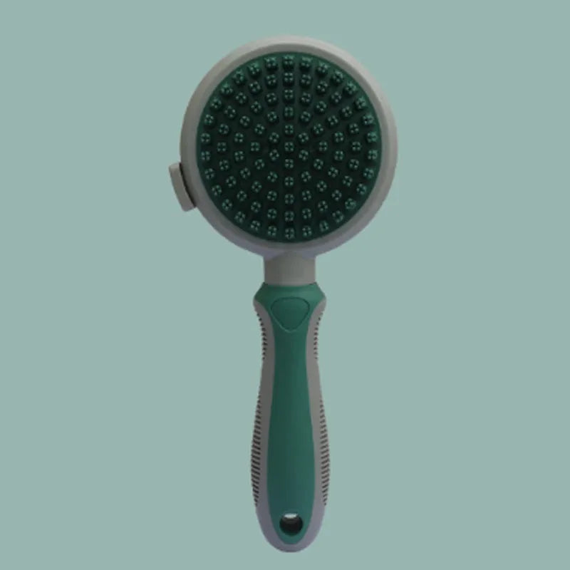 Green two-sided cat brush with retractable slicker and silicone massage pins on plastic handle