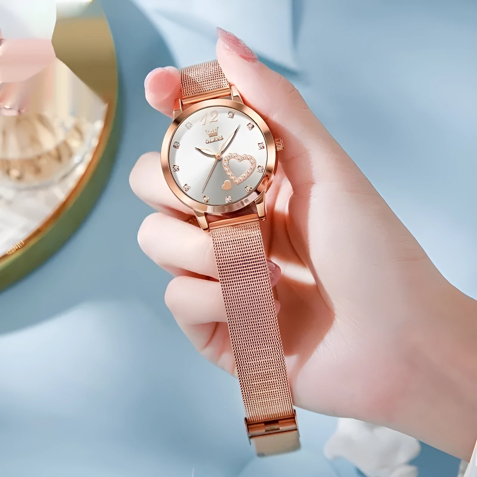 Women's fashion watch with rose shell alloy case and mesh strap, shown in multiple dial colour options.