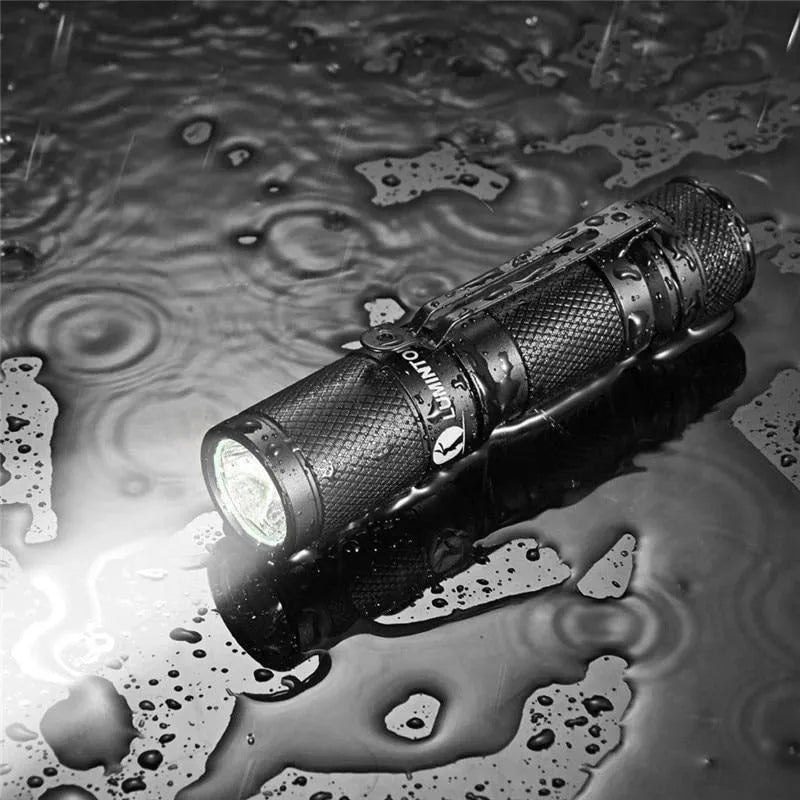 Black Lumintop Tool AA 2.0 keychain flashlight with magnetic tail cap and diffuser accessory
