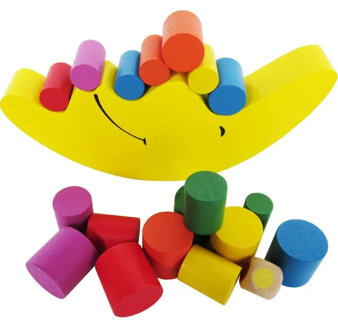 Yellow and blue wooden moon balance game toy for children ages 2-4 on white background