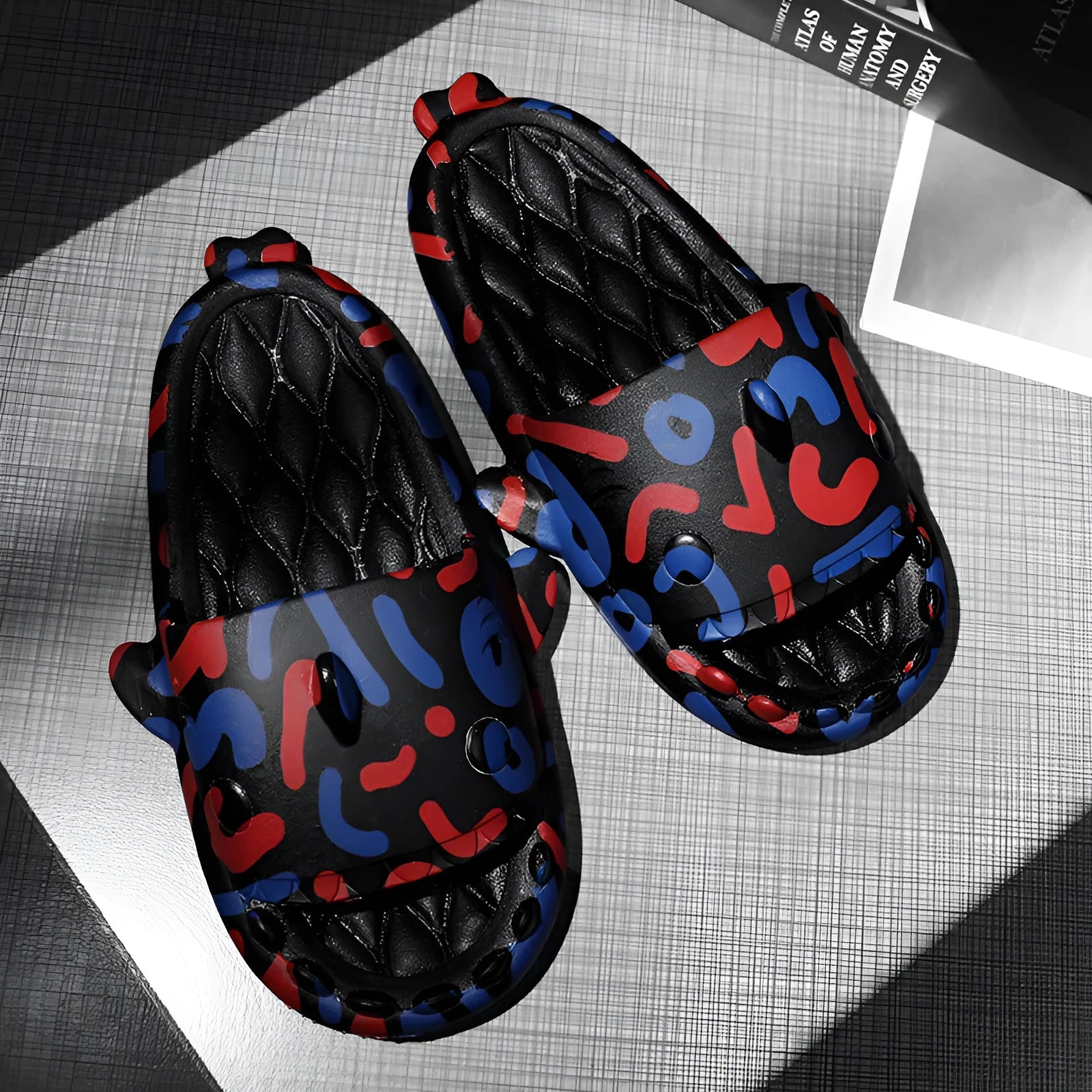 Casual open-toe shark design slippers in EVA material on a colour selection background.