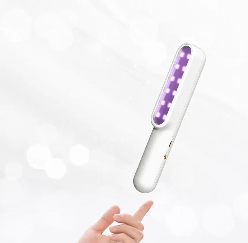Portable UV sterilisation lamp hand-held 265nm wavelength 219mm long in pink and white colours
