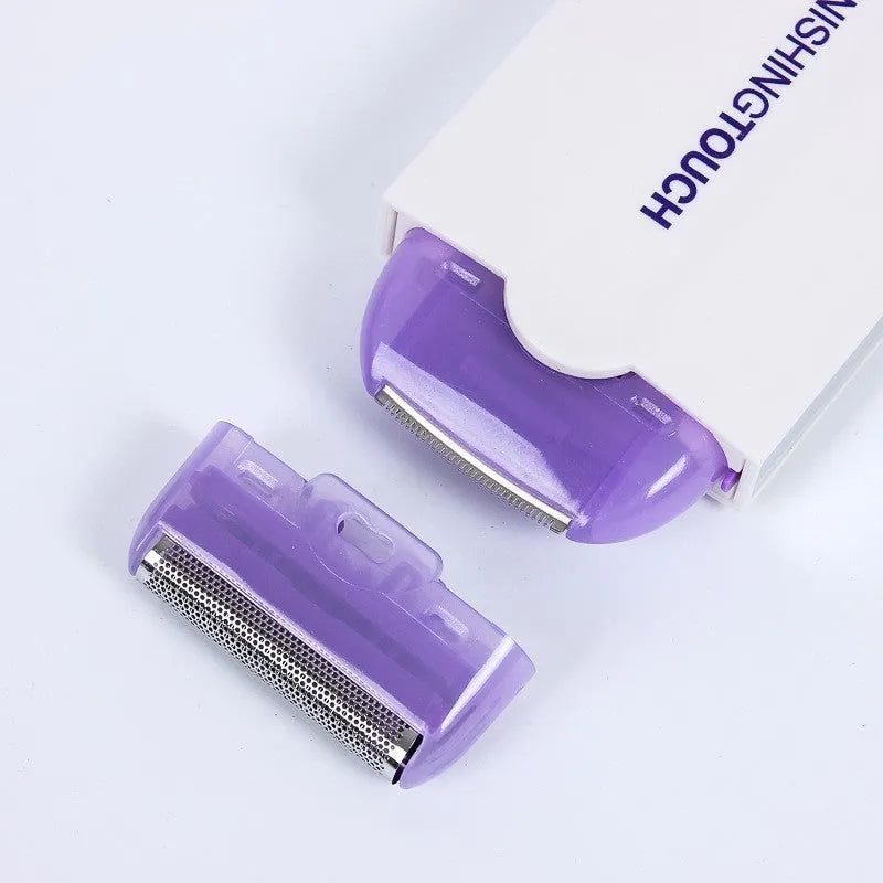 Black rechargeable electric hair remover with Sensa-Light head, trimmer head, foil head, USB cable and cleaning brush.