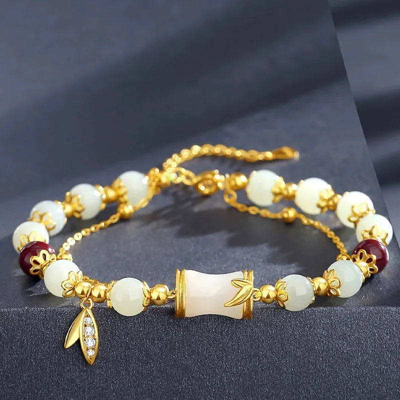 Retro style bamboo bracelet with coloured glass floral beads and ruyi design