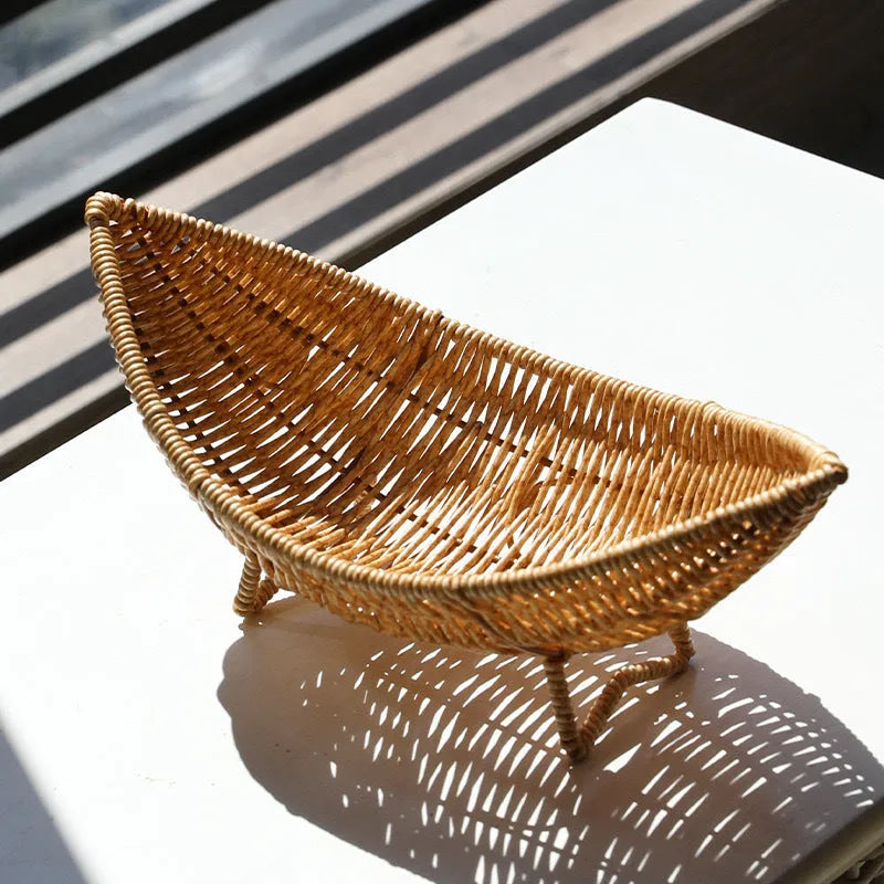 Plastic knitted basket fruit dim sum rack on a desktop with melon seeds and snacks