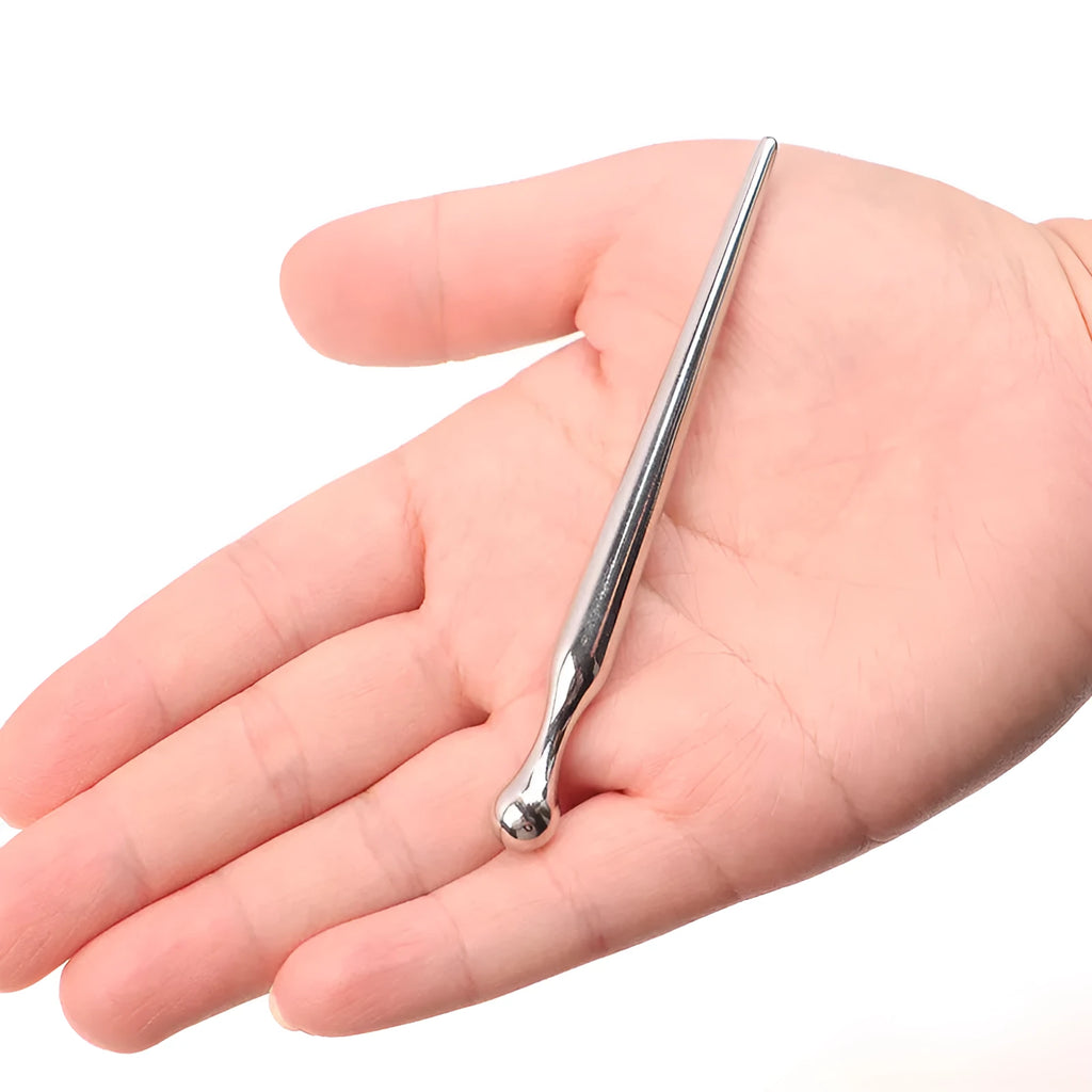 Silver metal urethral stimulation plug stick with round beads and a horse eye end design.
