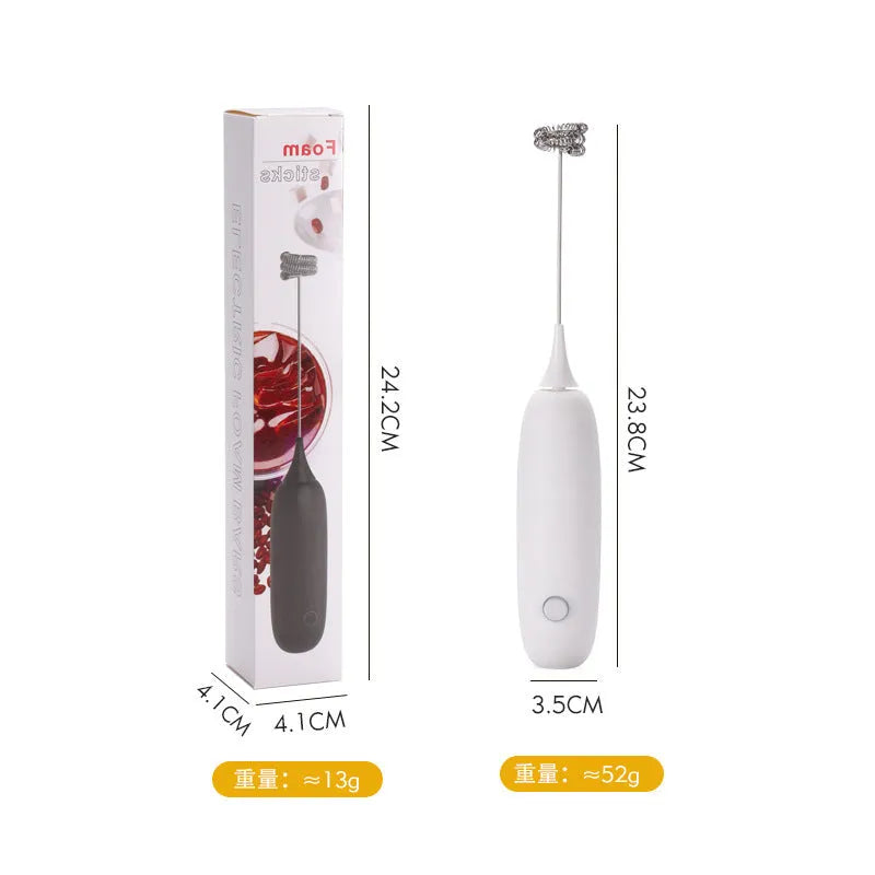 Black and white electric hand-held milk frother and blender for coffee beverages
