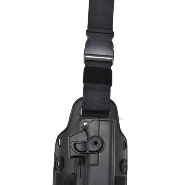 Green tactical plastic leg holster attached to a waist plate, showing quick-pull opening.