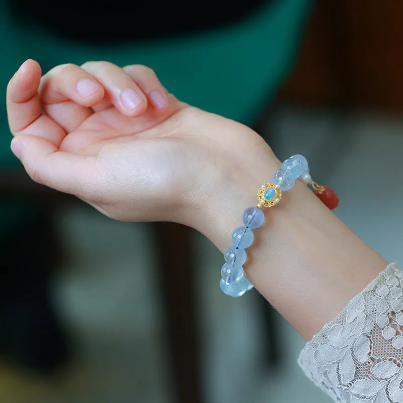Aquamarine gemstone and components for a DIY Fengjiu Chinese style bracelet kit for women.