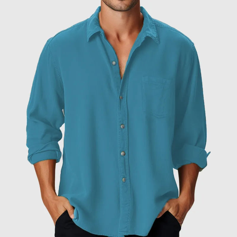 Man wearing a pure colour loose-fit polyester holiday shirt with a stand collar and long sleeves.