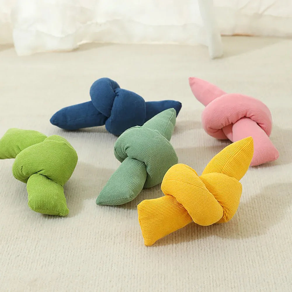 White cotton dog rope toy with multiple knots for tugging and chewing