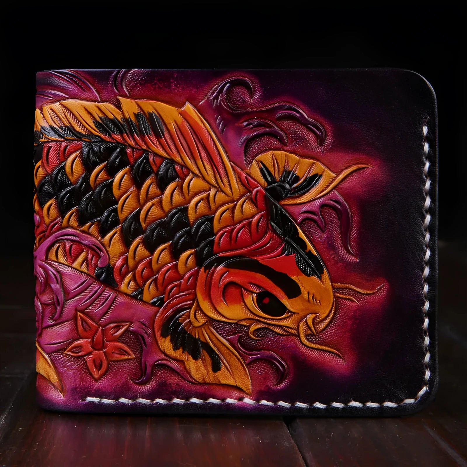 Men's red cow leather short wallet with carved details, shown open.