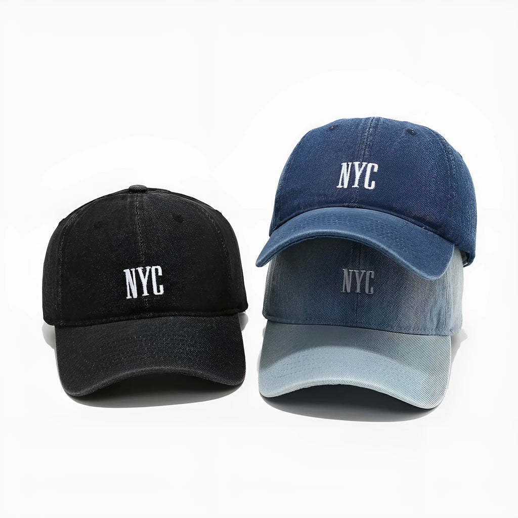 Retro denim peaked cap with embroidered letters on the front, shown in an adjustable size.