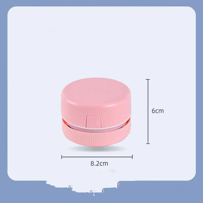 Portable mini desktop vacuum cleaner in blue colour with handheld design