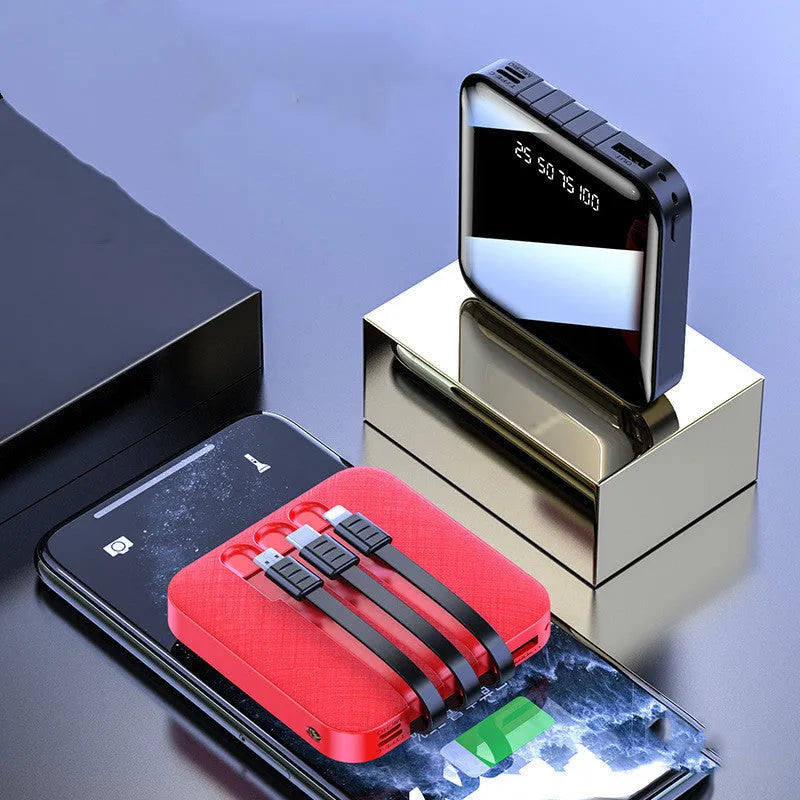 Black and red portable power bank with built-in charging cable, showing compact size.