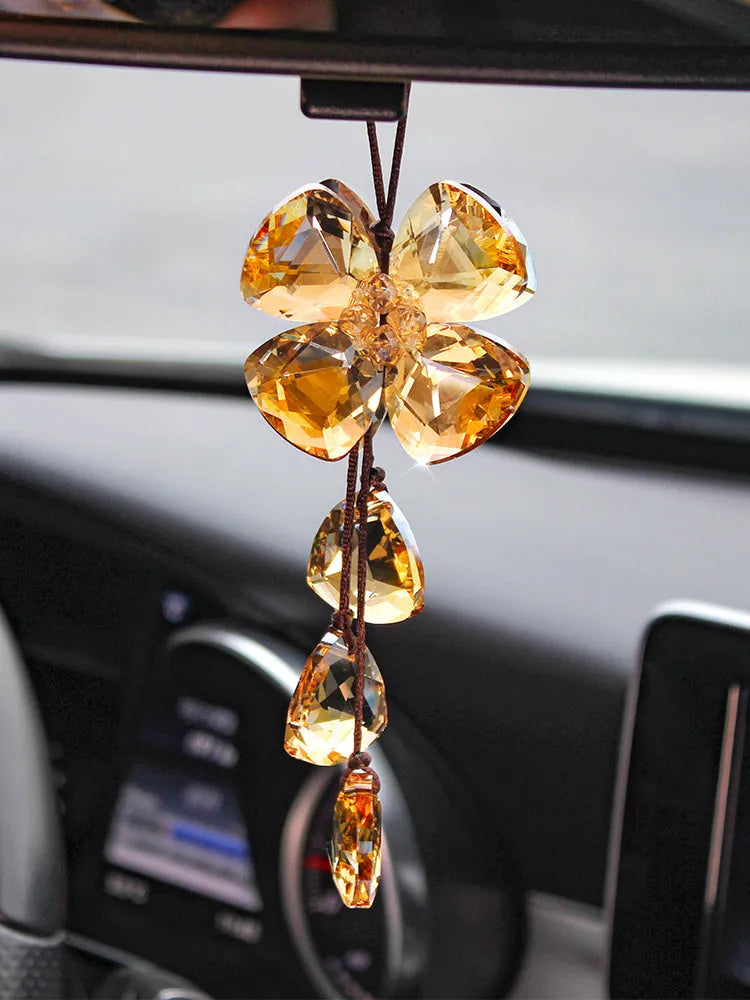 Crystal Four Leaf Grass car pendant hanging, showing its approximately 20cm size and transparent finish.