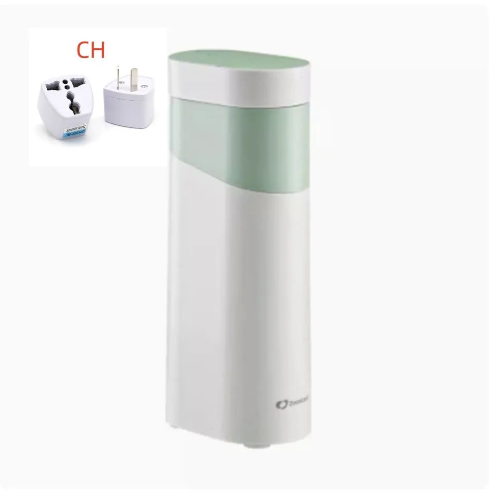 Black portable instant water dispenser with digital display on a wooden desktop.