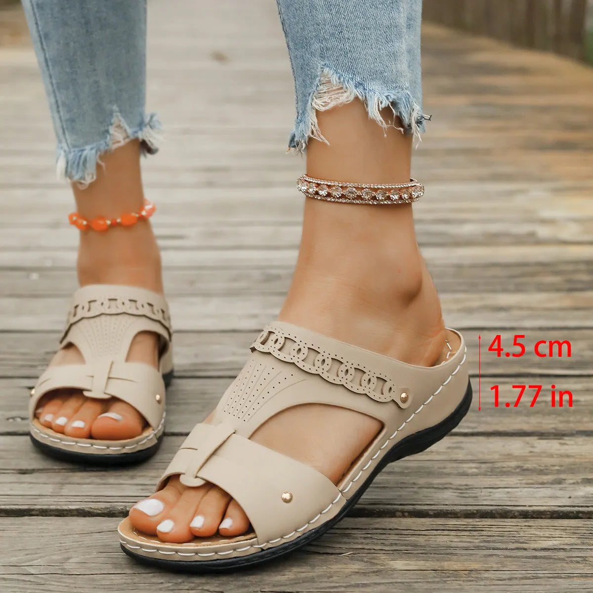 Blue Roman style slippers with a fish mouth toe holder and slope heel on a rubber sole.