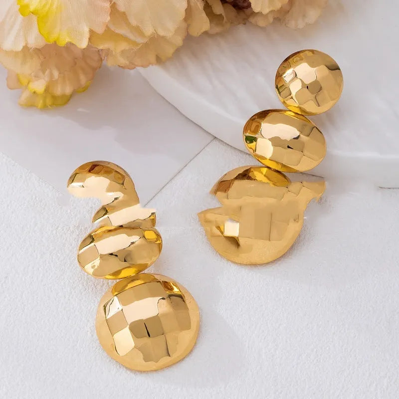 Retro women's polka dot metal bead drop earrings in frosted gold finish on a neutral background