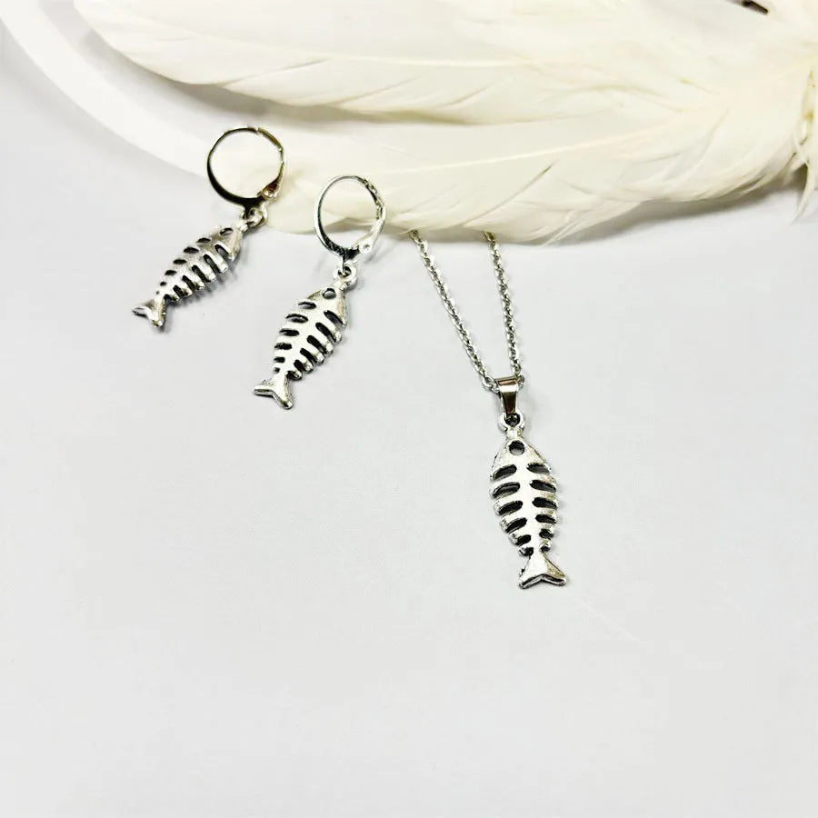 Retro fishbone pendant necklace and earrings set with adjustable alloy chain on a white background